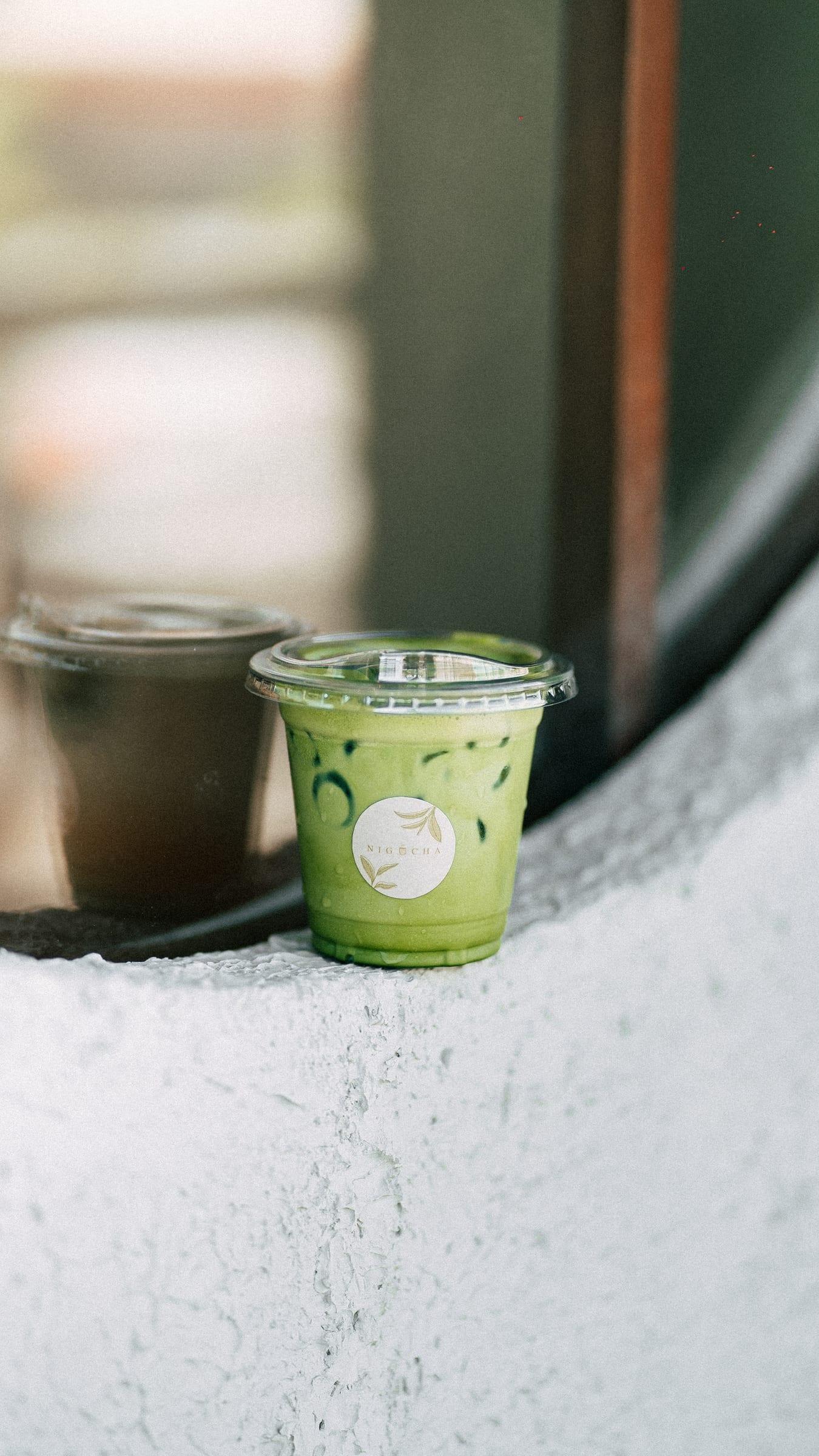 Two iced drinks on the round-window ledge